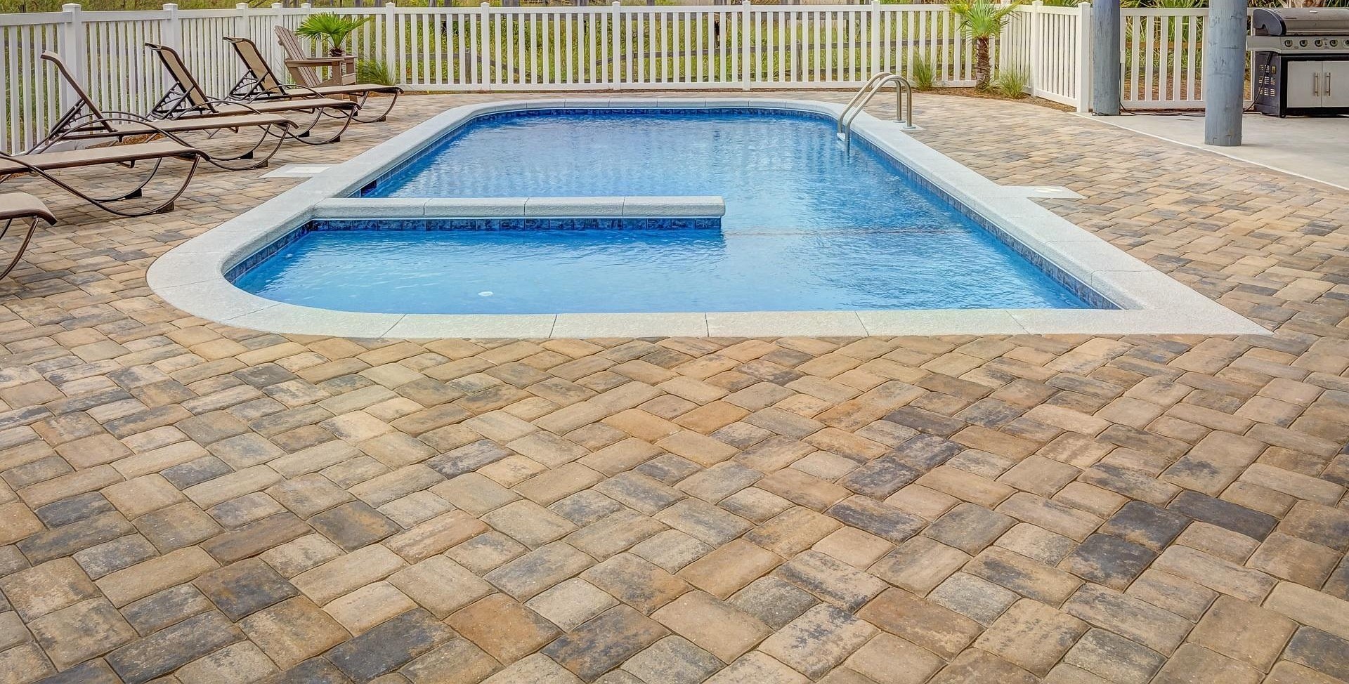 Pool surrounded by Stone Patio